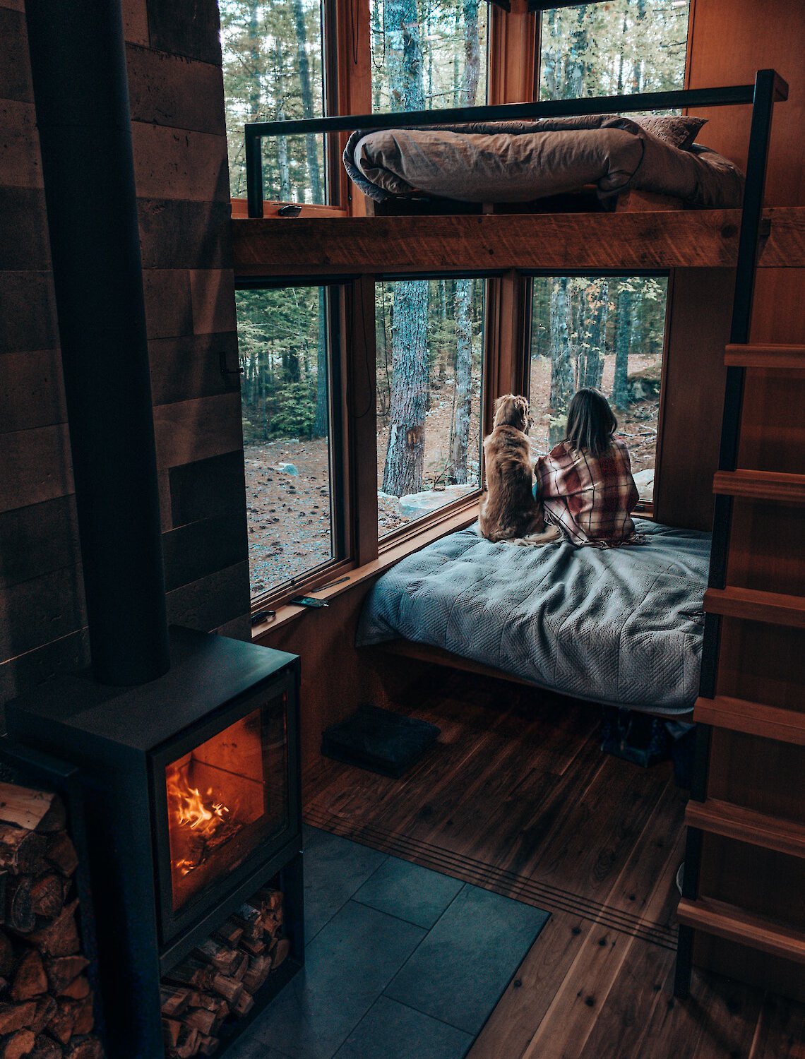 Owner and dog cozy in cabin together